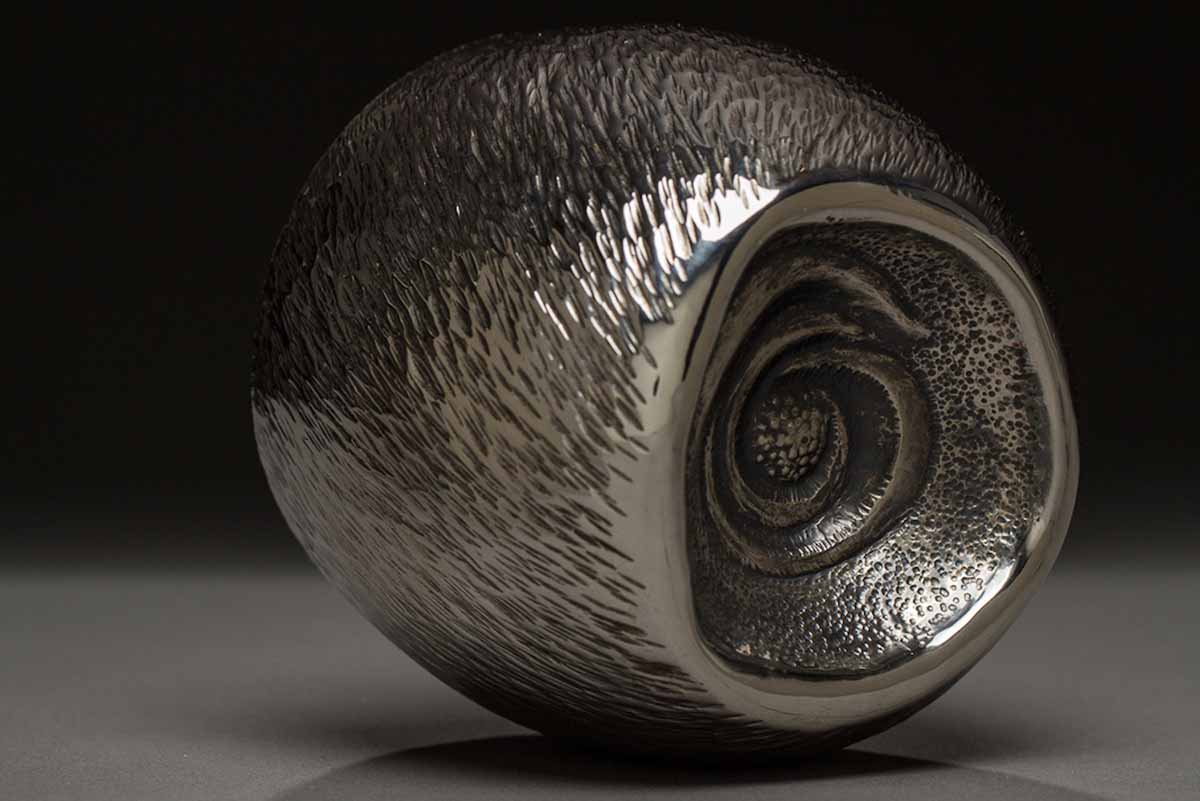 A close-up of a sterling silver sculpture. 