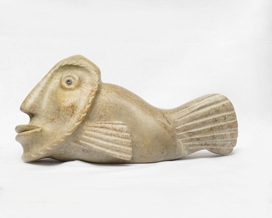 A soapstone sculpture symbolizing an anthropomorphized fish. 