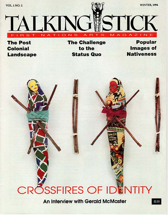 A cover photo for Talking Stick magazine, showing two Barbie dolls wrapped in colourful material and tied with ribbon and sticks. 