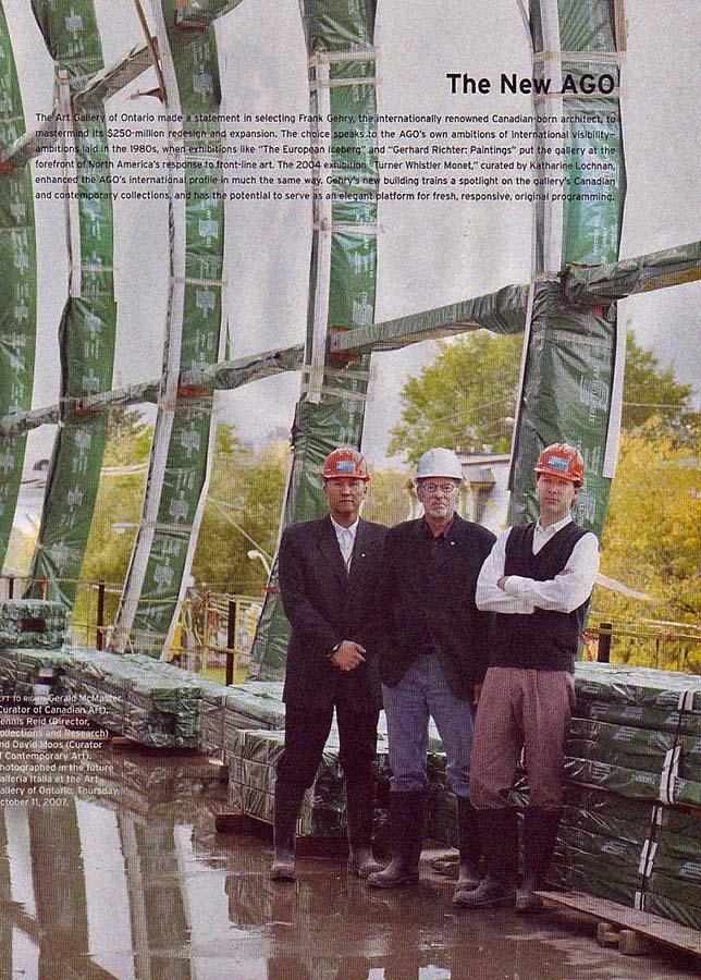 Three men in safety helmets stand on a construction site. 