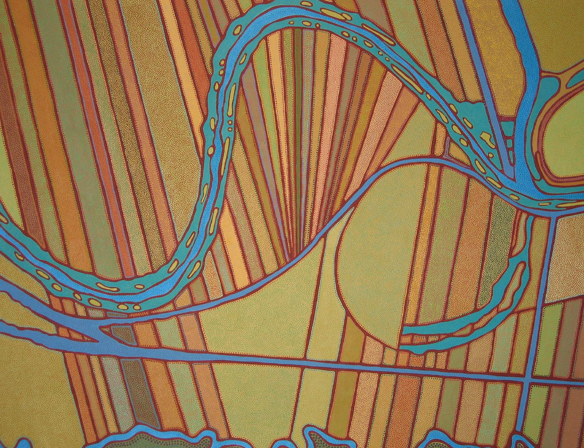 What looks like an aerial view of warm-toned, ploughed fields that contrast with the blue water of winding rivers or streams running through them. 
