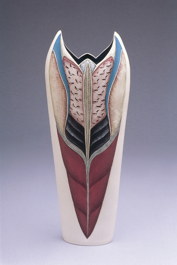 A vertical and symmetrical ceramic vessel, glazed in muted complementary tones within curving lines. 
