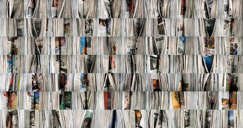 A mosaic of piles of newspapers. 