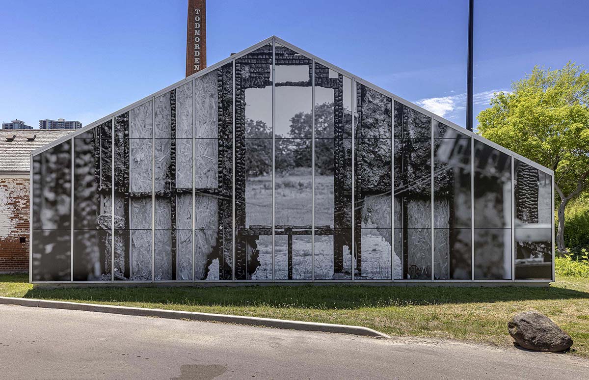 Exterior view of a building covered in art. 